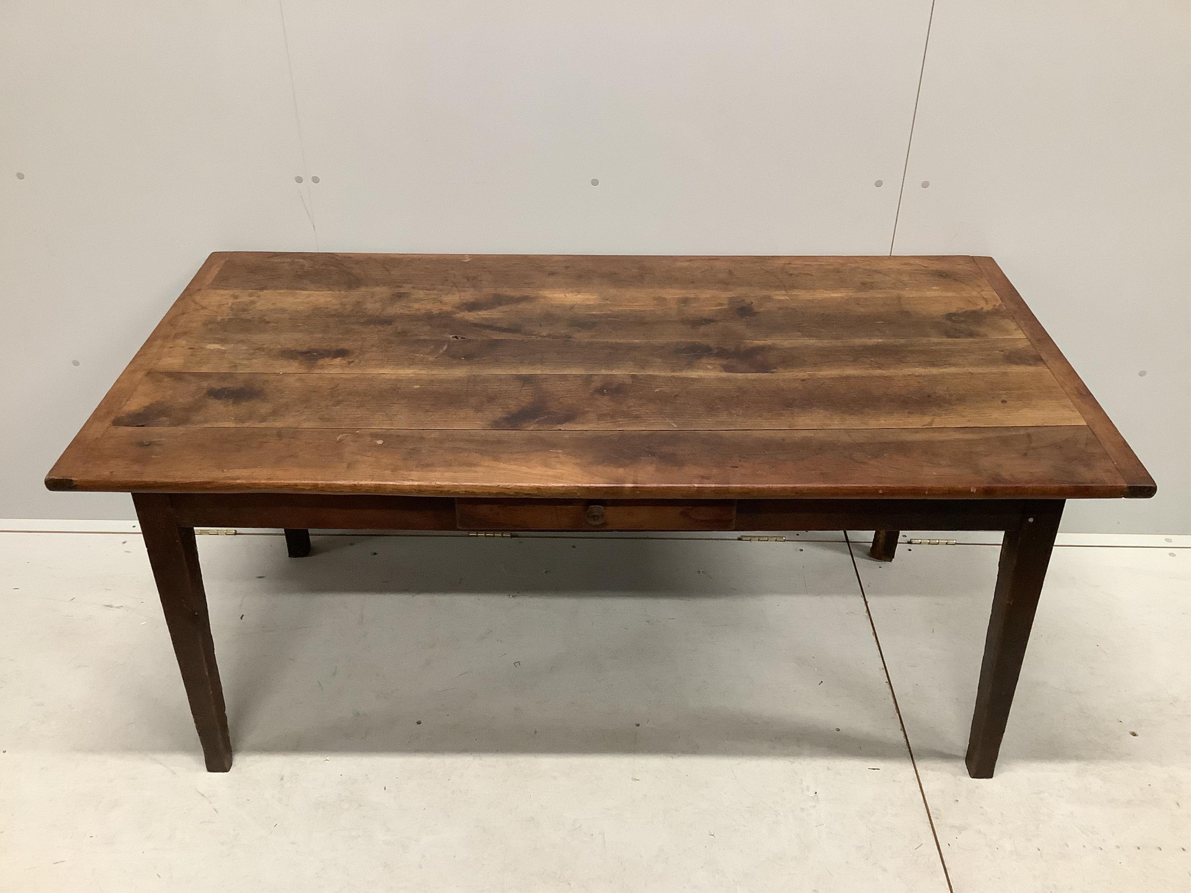 A 19th century French rectangular oak kitchen table, fitted drawer on square tapered legs, width 164cm, depth 83cm, height 72cm. Condition - fair, top with knot hole, all legs have losses due to old worm infestation, now